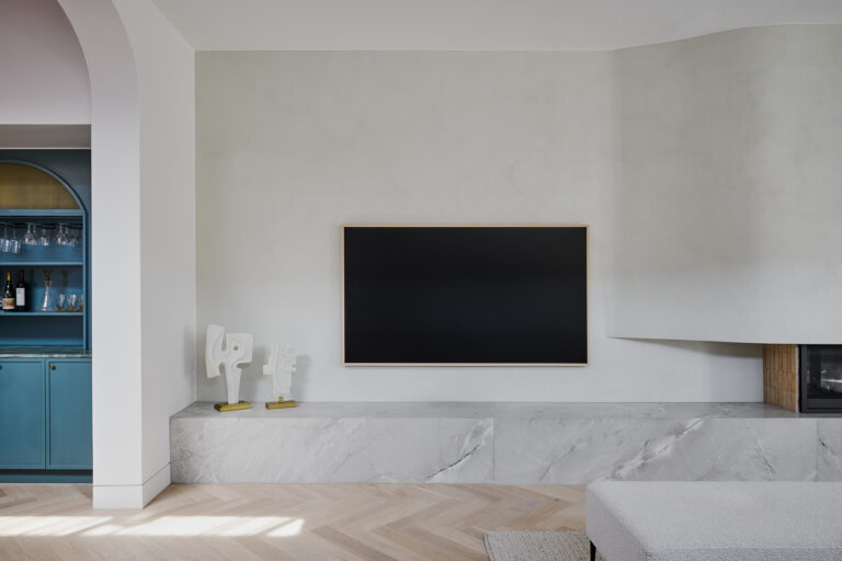 Living room renovation with custom curved fireplace and custom furniture designed by ACP Studio Interior Design in Coogee, Sydney.