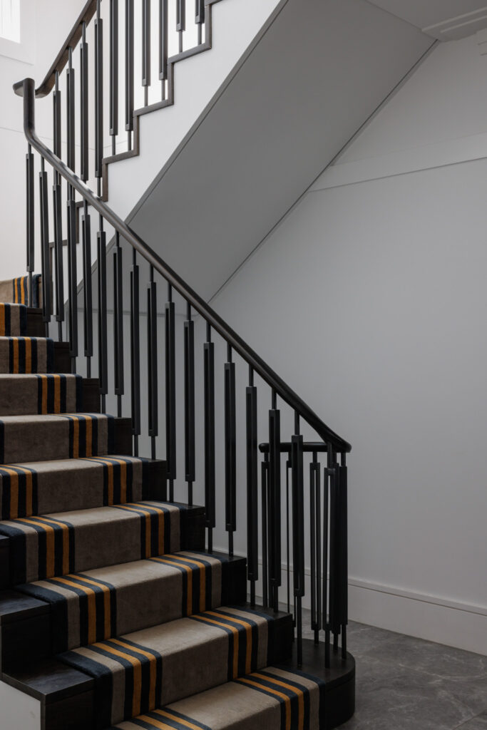 New build staircase interior design with custom designed balustrade and stair runner designed by ACP Studio Interior Design.