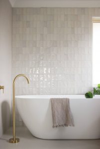 Bathroom renovation interior design, freestanding bath, hand made feature wall tile with brass floor spout designed by ACP Studio Interior Design in Point Piper, Sydney.