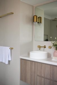 Bathroom renovation interior design, custom designed oak vanity with brass tap ware and lighting designed by ACP Studio Interior Design in Point Piper, Sydney.