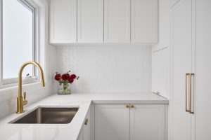 Seaforth house renovation interior design and decoration with custom designed butlers pantry and laundry with white joinery and white marble bench top designed by ACP Studio Interior Design in Seaforth, Sydney.