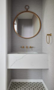 Powder Room renovation interior design with marble vanity, textured wallpaper and concrete floor tile designed by ACP Studio Interior Design in Seaforth, Sydney.