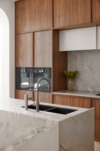 Kitchen renovation, custom designed walnut veneer kitchen with marble splash back and wall ovens designed by ACP Studio Interior Design in Coogee, Sydney.