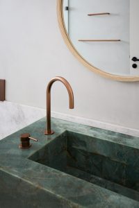 Bathroom renovation, custom green marble vanity and copper tap ware designed by ACP Studio Interior Design in Coogee, Sydney.