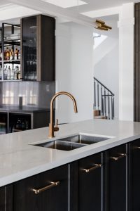 New build kitchen with feature pendant light, dark oak joinery and Brodware Tap ware designed by ACP Studio Interior Design in Epping, Sydney.