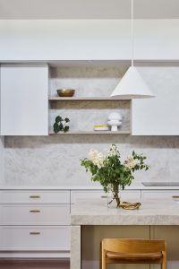 Kitchen renovation, clean and fresh coastal home. Taj Mahal quartzite kitchen with white joinery brass tap ware designed by ACP Studio Interior Design in Balgowlah Heights, Sydney.