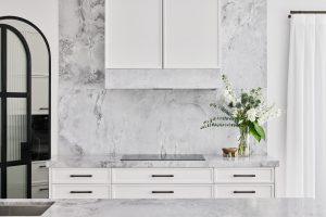 Kitchen renovation with super white marble back splash and fluted glass door designed by ACP Studio Interior Design in Vaucluse, Sydney.