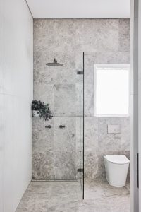 Bathroom renovation with grey marble tiles and walk in shower designed by ACP Studio Interior Design in Vaucluse, Sydney.